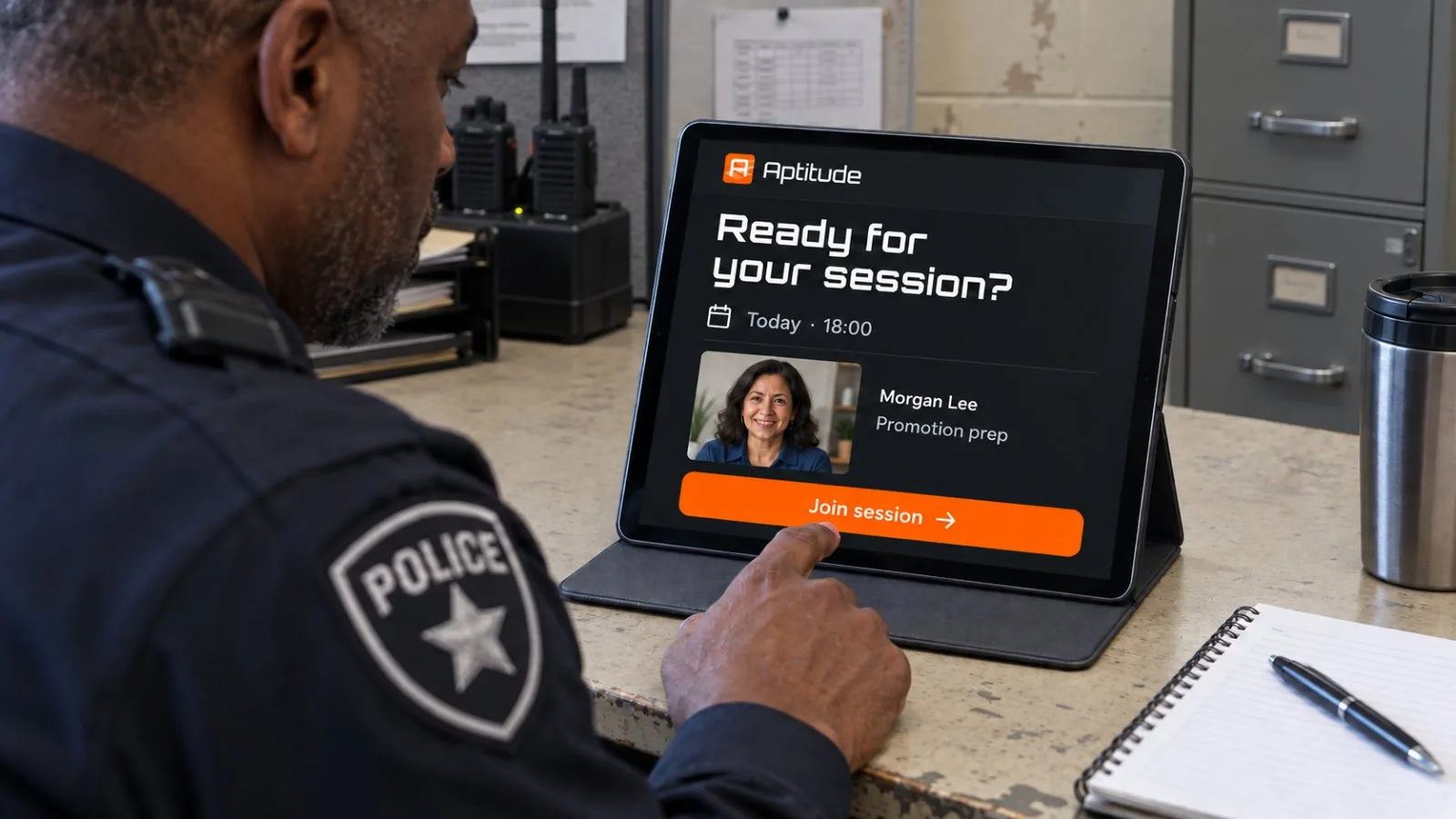 An officer opening a booked Aptitude coaching session on a tablet