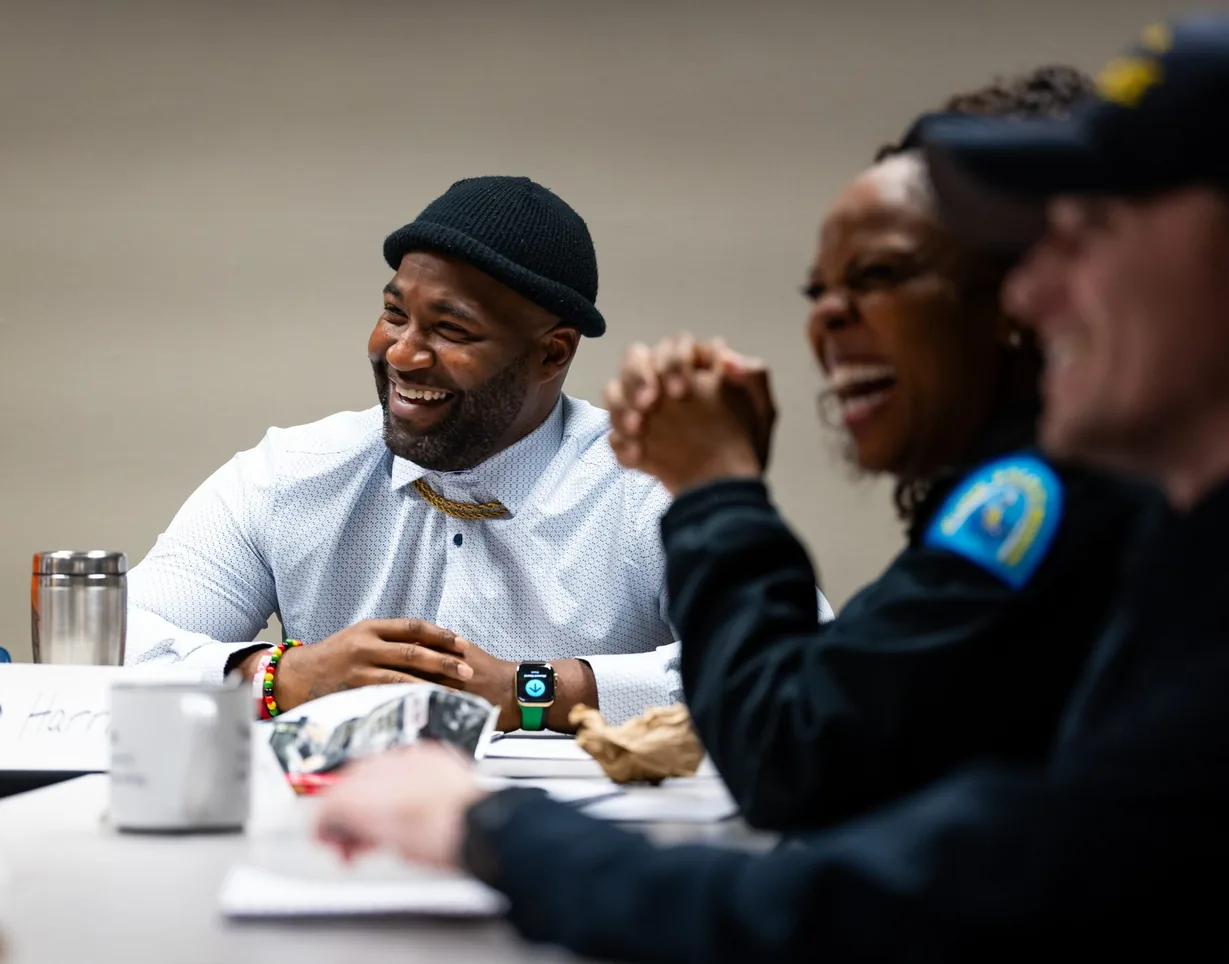 Recruiters laughing during an on-site recruitment training session