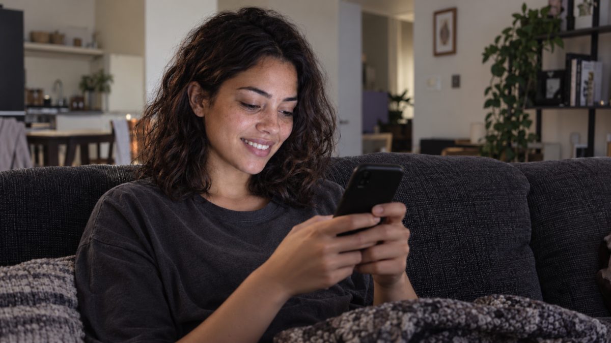 An applicant answering a clarification request on her phone