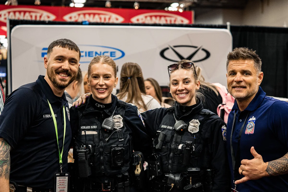 Greg Zaroslinski with officers at a recruiting event